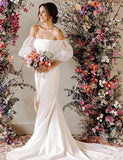 Robe de mariée fourreau avec manches bouffantes