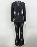 Costume féminin 2 pièces slim fit à revers pointus noir scintillant et double boutonnage
