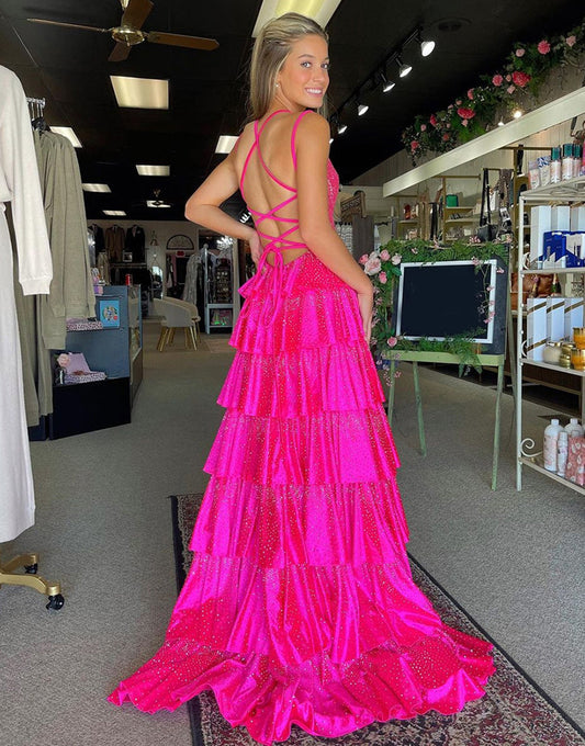 Robe de bal longue à volants et fente en tulle fuchsia pailleté
