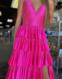Robe de bal longue à volants et fente en tulle fuchsia pailleté