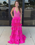 Robe de bal longue à volants et fente en tulle fuchsia pailleté