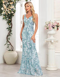 Robe de bal sirène bleue à col en V et paillettes appliquées avec longueur au sol