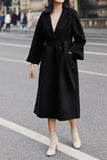 Manteau de laine ceinturé à revers noir avec poches