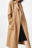 Manteau de laine ceinturé à revers noir avec poches