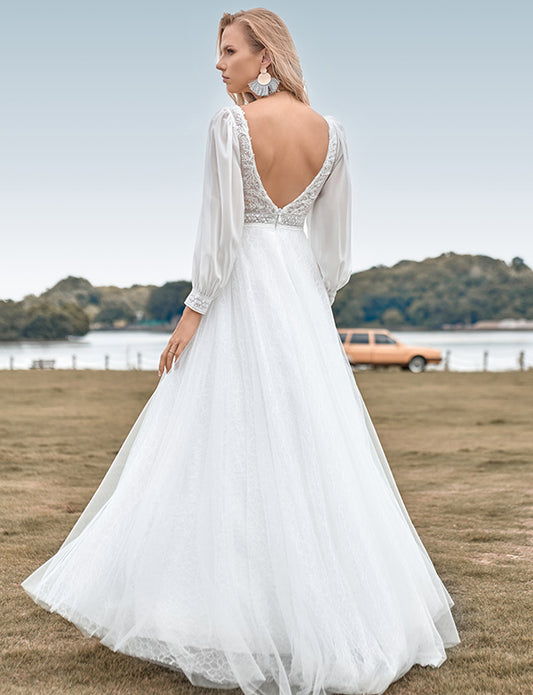 Robe de mariée ivoire en tulle perlé avec manches longues