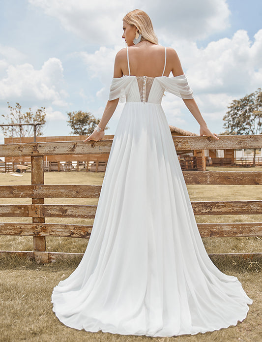 Robe de mariée brodée en mousseline de soie ivoire, à épaules dénudées