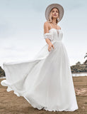 Robe de mariée brodée en mousseline de soie ivoire, à épaules dénudées