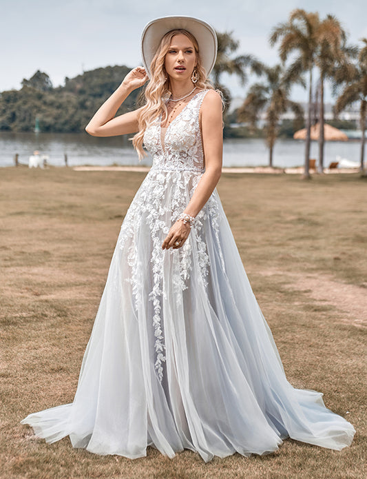 Robe de mariée ligne A en tulle ivoire avec applications