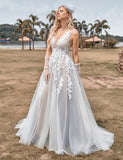 Robe de mariée ligne A en tulle ivoire avec applications