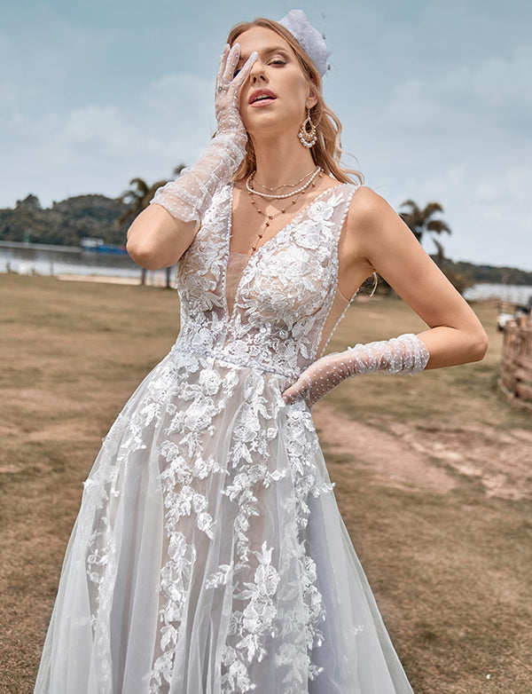 Robe de mariée ligne A en tulle ivoire avec applications
