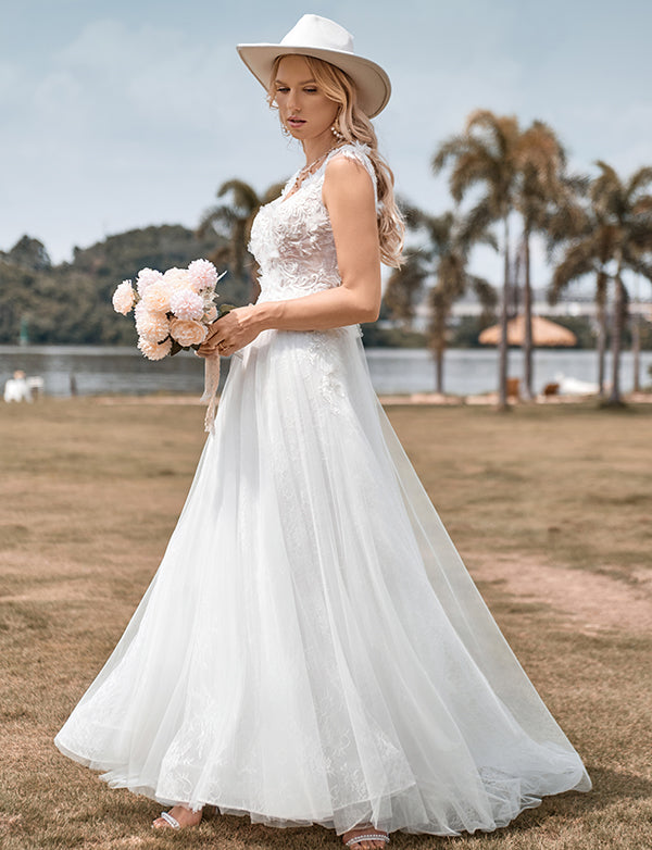 Robe de mariée longue ligne A en tulle perlé ivoire scintillant