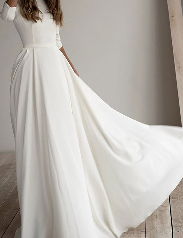 Robe de mariée longue à manches 3/4 de couleur blanche