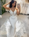 Robe de mariée sirène ivoire à col en V et bretelles spaghetti avec applications