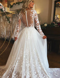 Robe de mariée ivoire à col en V et manches longues en tulle et dentelle