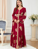 Robe dorée à la mode à manches longues et col en V