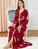 Robe dorée à la mode à manches longues et col en V