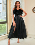 Robe de soirée en maille noire ornée de strass
